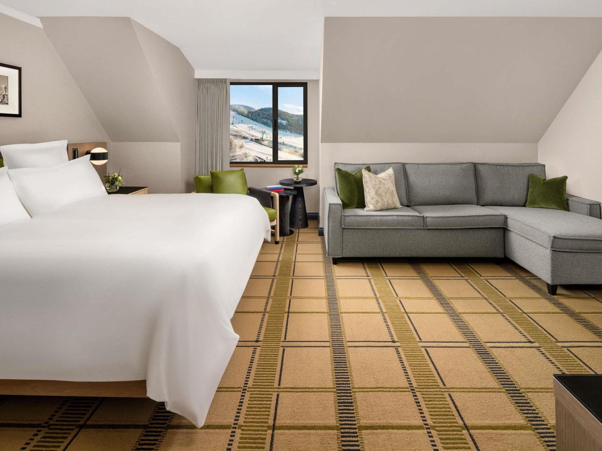 Deluxe King Room with Seating Area and Sofa Bed